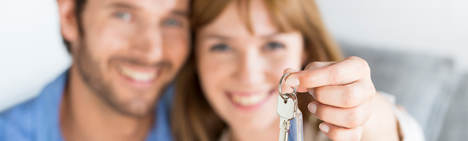 Couple holding the keys to their new home